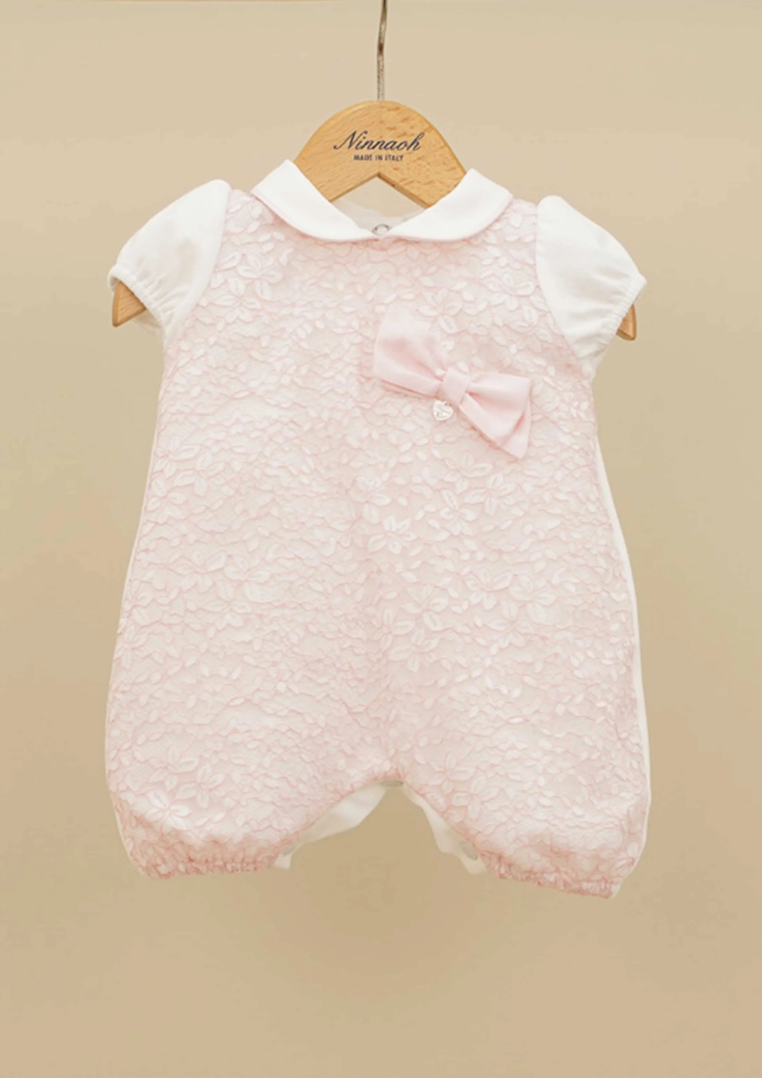 Ninnaoh pink romper with socks.